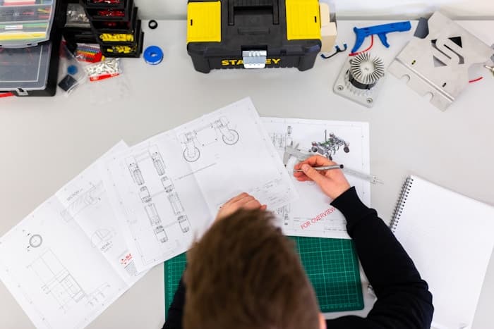 Engineering desk with metal fittings and technical drawings